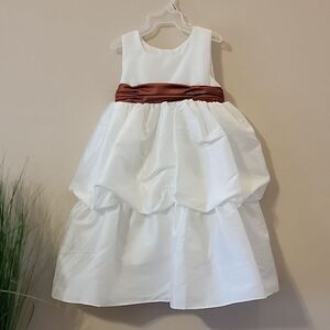 SWEET BEGINNINGS IVORY SPECIAL OCCASION PAGEANT DRESS WITH BURNT ORANGE BELT/BOW